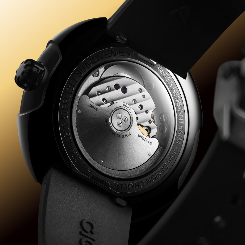 Time Cipher Gold. The automatic movement is visible through the sapphire caseback.